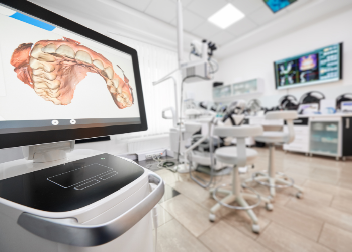 Dental technology display showing a 3D model of teeth in a modern dental office, emphasizing advancements in periodontal therapy and oral health management.